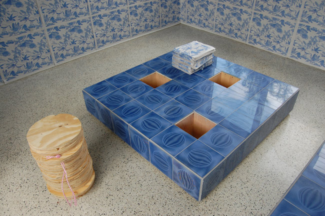 Gean Moreno and Ernesto Oroza. Untitled (decoy), 2010. Wood and found tiles. Functional object 48” x 48” x 12”